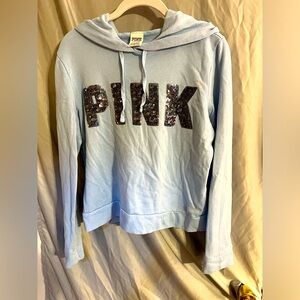 VS PINK light blue sweatshirt with sequins.